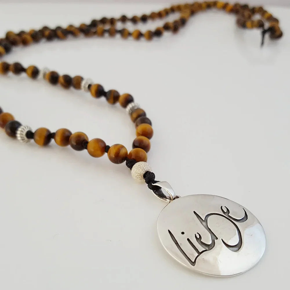 Exklusive Tigerauge-Mala „Liebe“ – handgeknüpfte Meditationskette, Original von Sign by Jwala®, Limited Edition, hochwertiger Edelsteinschmuck für innere Stärke und Herzöffnung