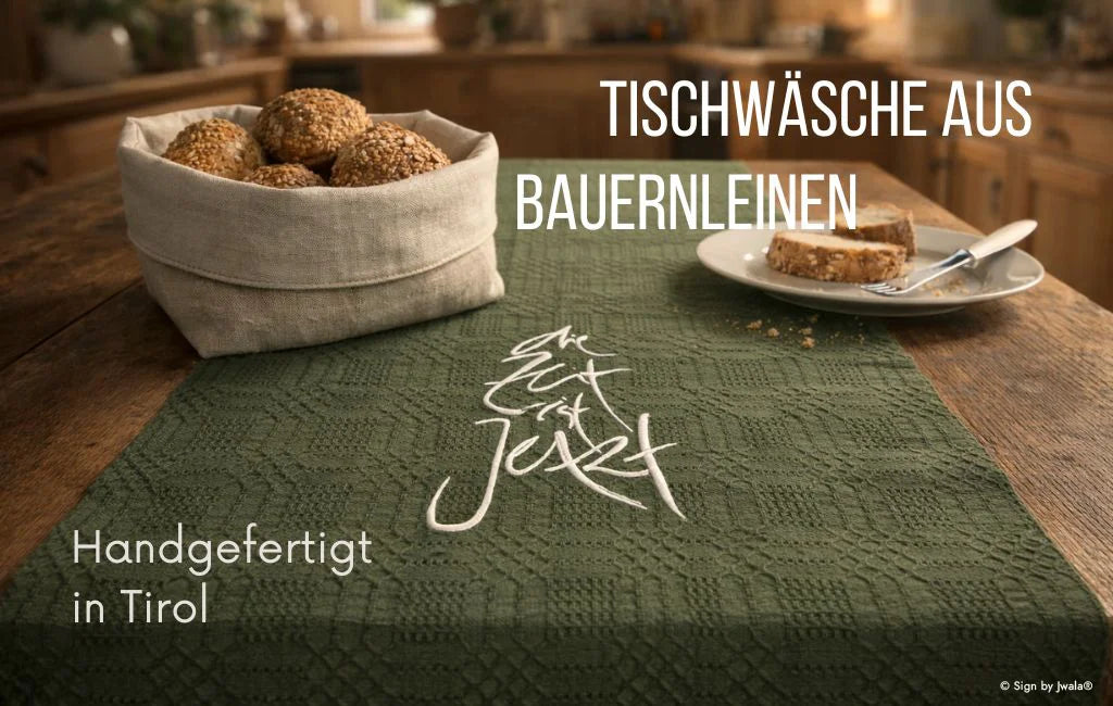 Handgewebter Tischläufer und besticktes Brotkörbchen aus Tirol – exklusive Tischwäsche aus Bauernleinen, liebevoll gefertigt in der Claudiaschlössl-Manufaktur