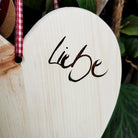Zirbenholz Herz mit eingebrannter Botschaft „Liebe“