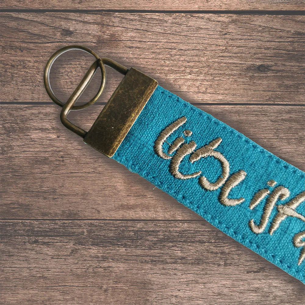 Designer Taschenanhänger türkis – hochwertiges spirituelles Accessoire