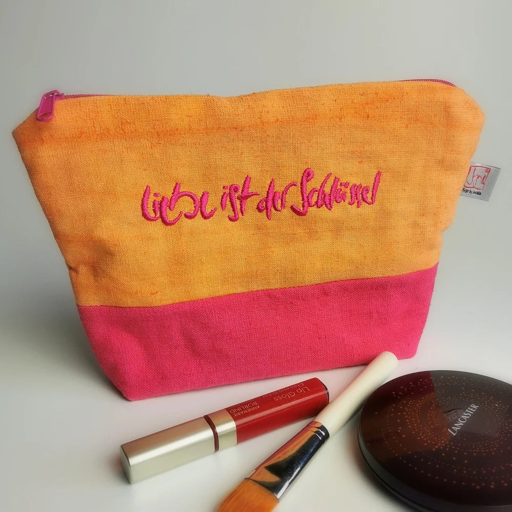 Handgefertigte Kosmetiktasche „Liebe ist der Schlüssel“ in Orange und Pink