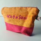 Handgemachte Make-up-Tasche „Liebe ist der Schlüssel“ in Orange und Magenta