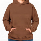 Vorderansicht eines unbedruckten Oversized-Hoodies in warmem Hertiage Brown ohne Sign, ideal zum Personalisieren.