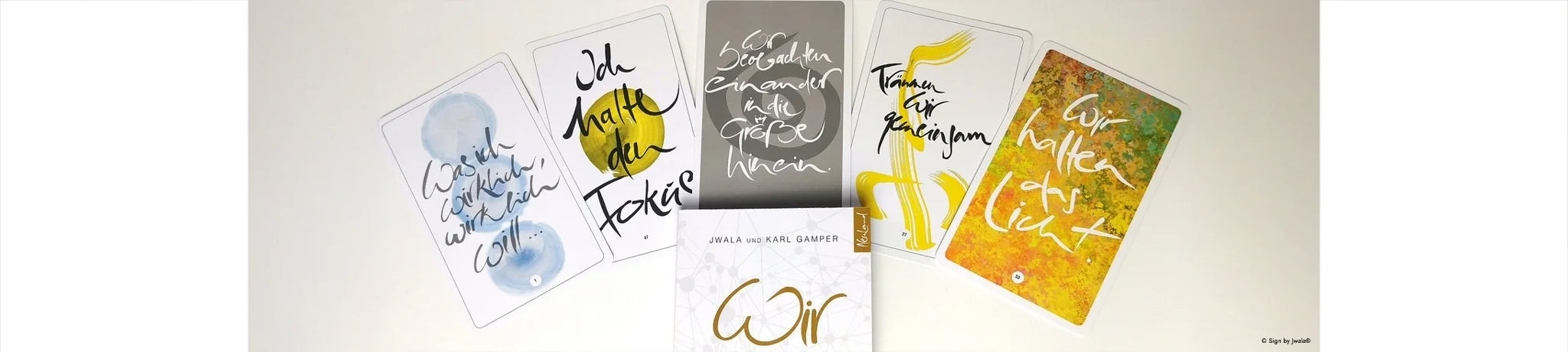Inspirationskarten von Signs by Jwala® und das Buch "Wir" aus dem SignShop Tirol 
